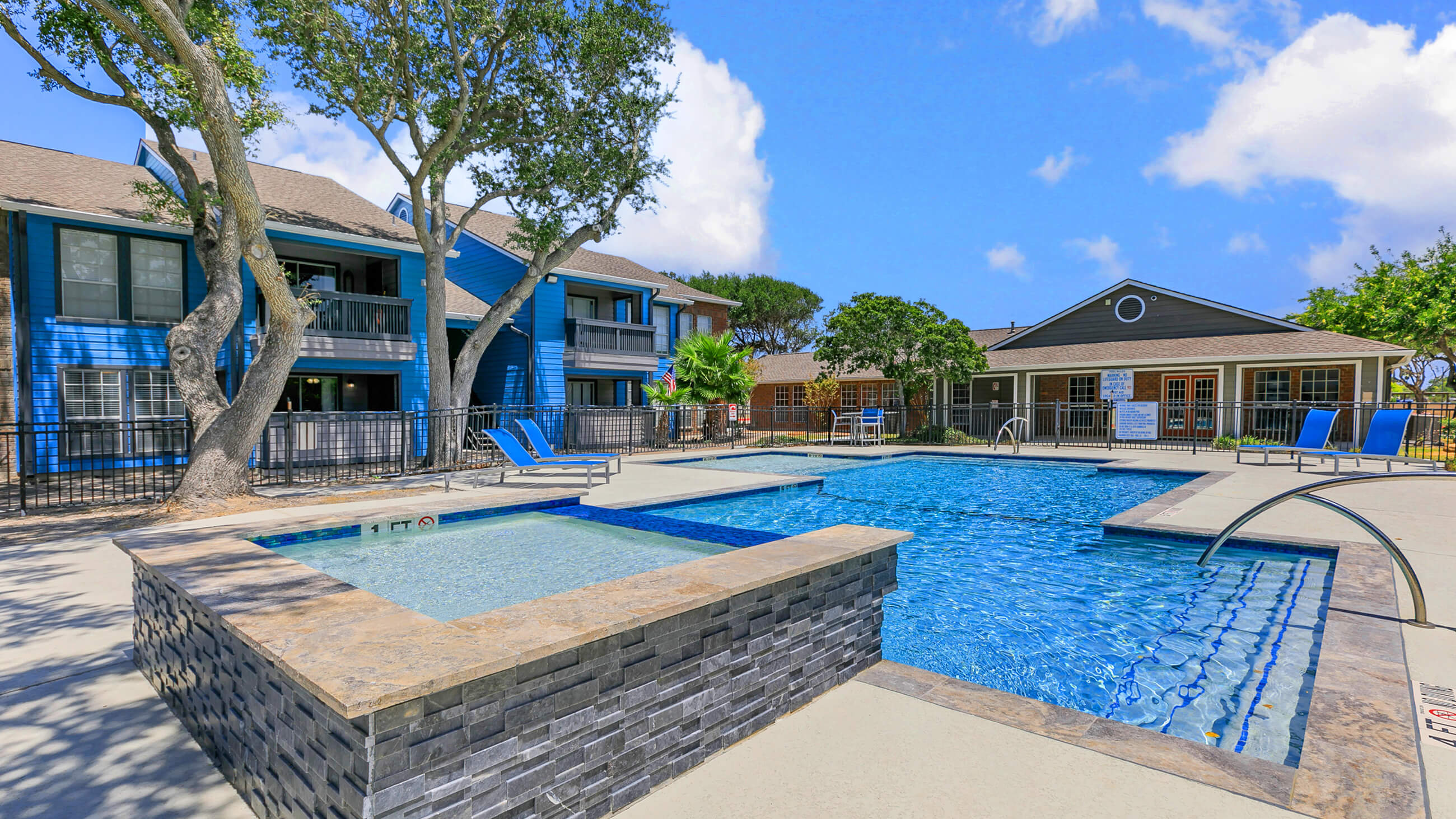 outdoor pool area of an apartment complex